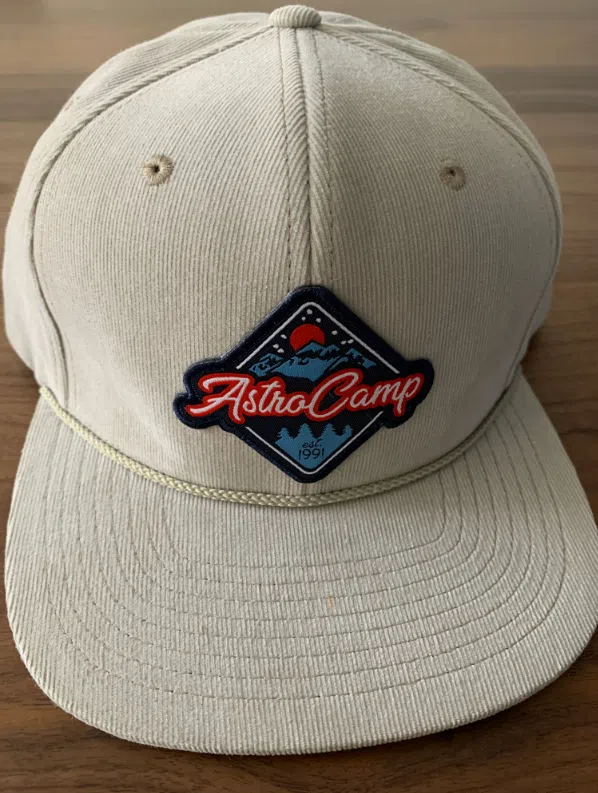 a baseball cap with an astrocamp logo