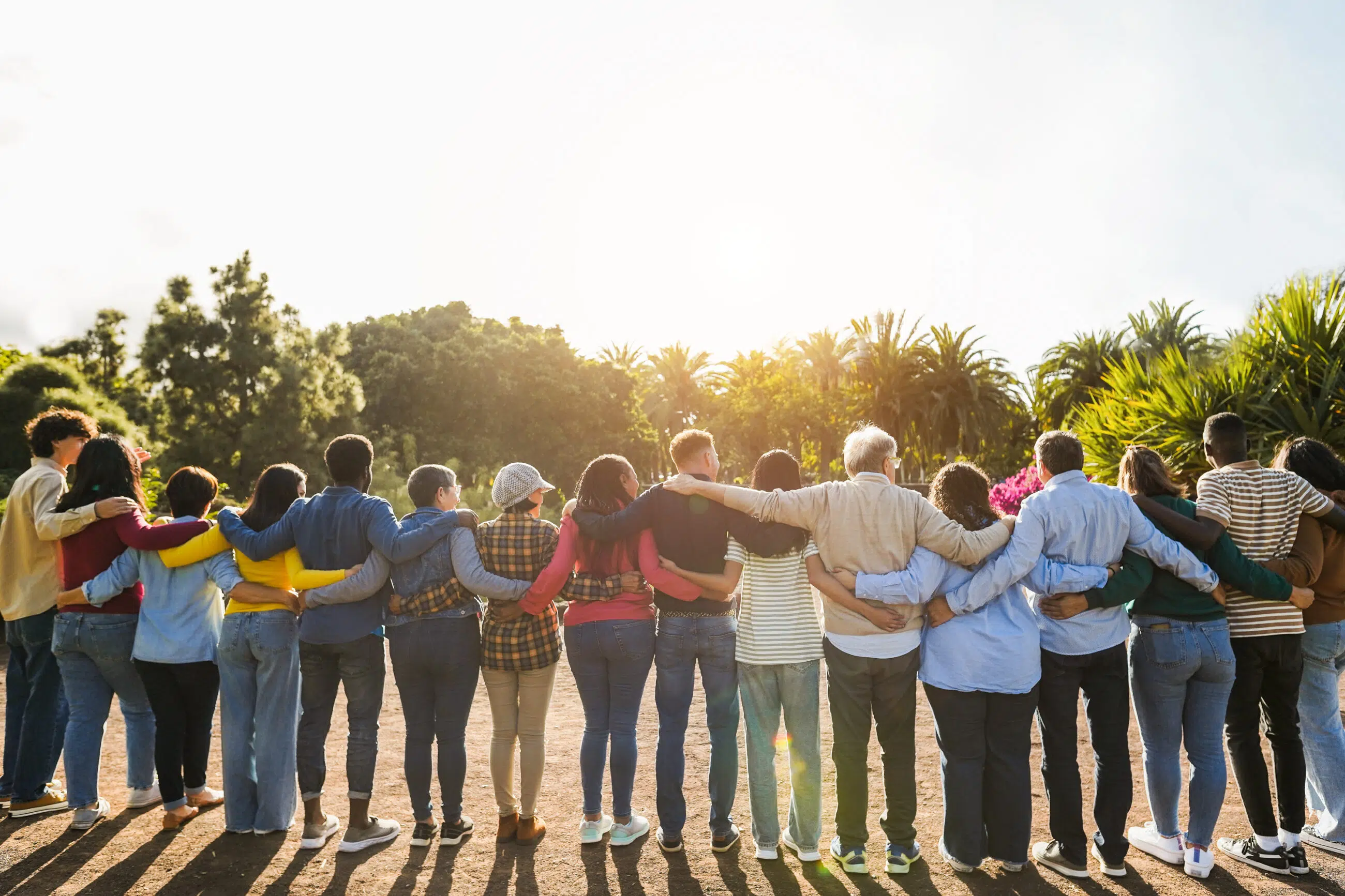 Group of volunteers hugging each other