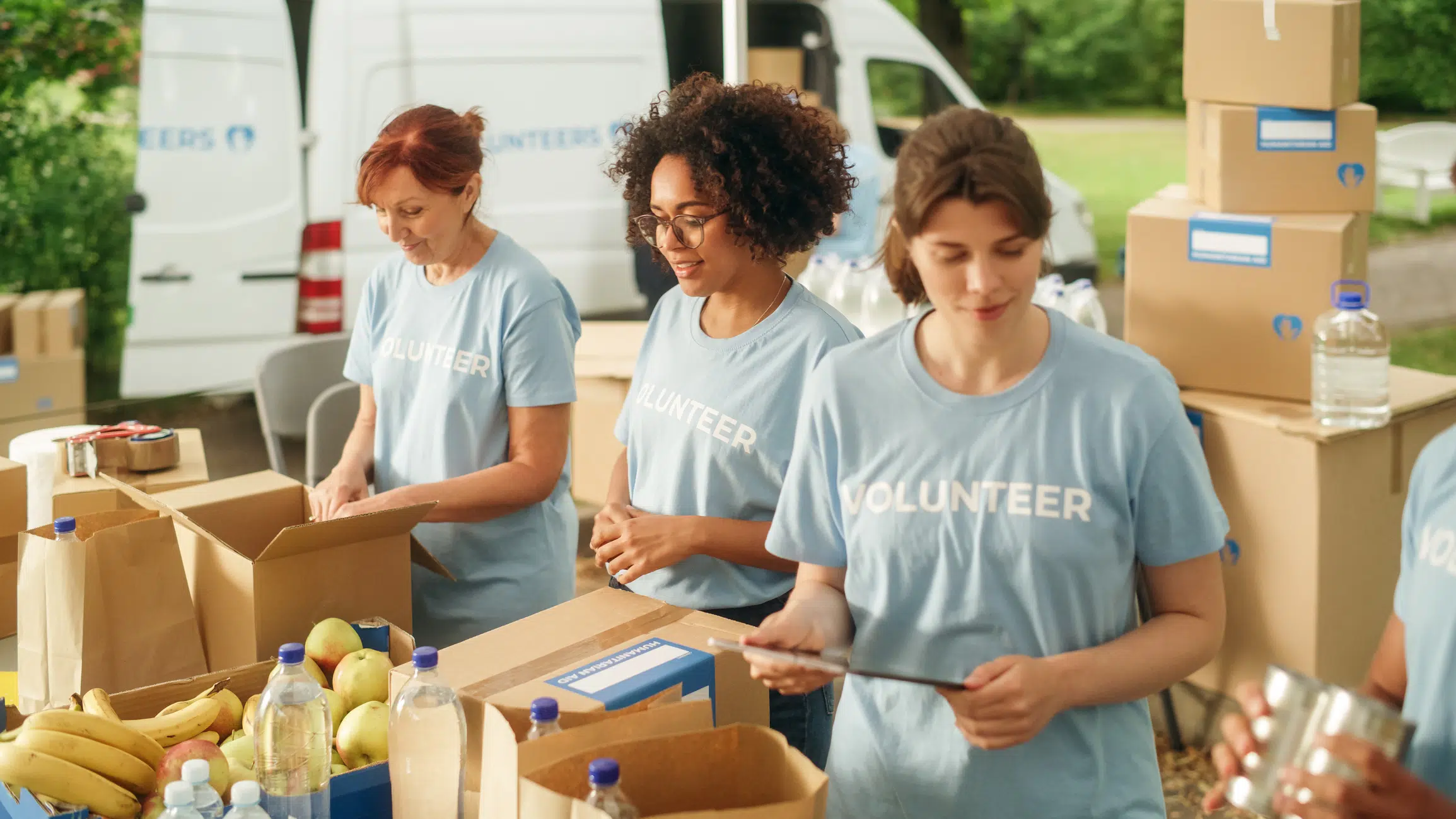 Group of Volunteers Preparing Free Food Rations for People in Need