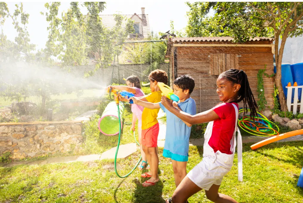 campers using water guns for aqua tag