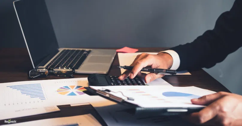 invoicing system on paper business man using calculator by laptop
